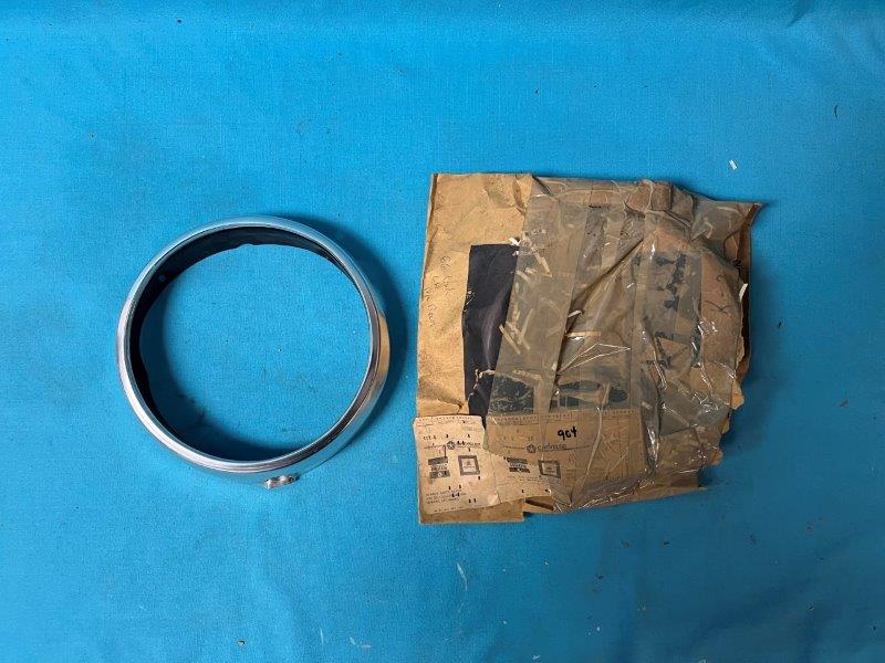 Headlight Bezel - Drivers side