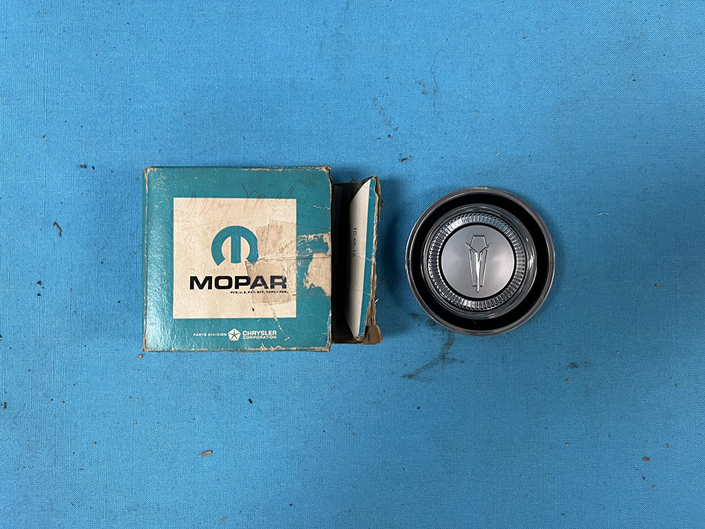 Center Round Horn button emblem for Signet models...Technically correct for 1966 year only - these can fit for the 1964-65 years as well.  For those years you have a "V" logo in the middle instead of the Plymouth logo here for 1966 as it changed in 1966 to this logo instead.