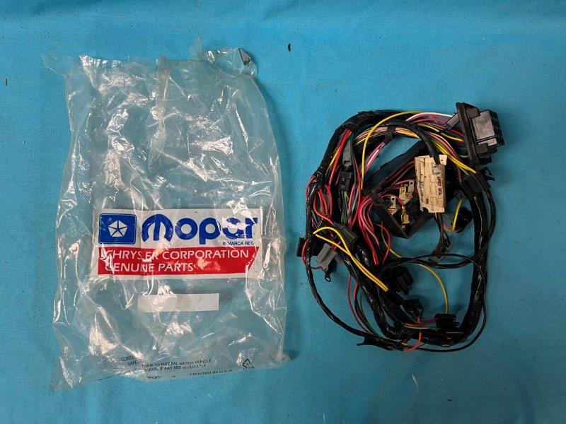 New old stock Wiring Harness - under dash with bulkhead connector.  Intact and in good shape.  All wires soft and flexible as been inside temp control storage since purchase of dealership stock in 1982...
