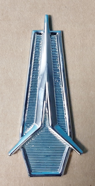 Rear Seat Medallion with push on retainer studs and clips - center seat "PLYMOUTH" logo medallion.