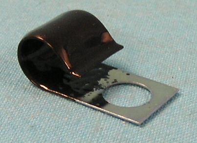 Wire Retaining Clip - 727 Tranny - found commonly under the upper Left bell housing-to-block mounting bolt.   Can be used On manual tranny side covers in conjunction with part# WO-AX41.  Automatic or Manual Trannys.  Used to secure the reverse light/ neutral safety wire harness as it passes from the firewall bulk head connector to the transmission switch.	 They are formed form the correct gauge steel, zinc plated, and thermo-plastic coated for proper appearance.