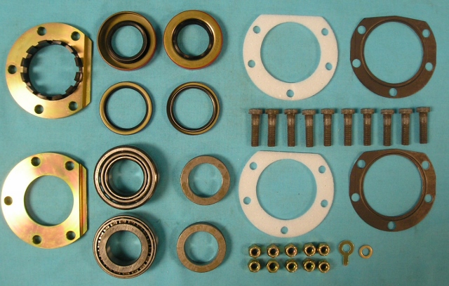 Tapered Axle Bearing Package - 8-3/4. Billet Steel Adjuster and retainer, long housing end studs, nuts and locking	Tab.  Kit also includes, 2 sets of Timken bearings, 2 races, 2 white foam	Outer gaskets, 2 lock rings, 2 OEM beaded steel inner gaskets, 2 inner axle seals and 2 outer axle seals