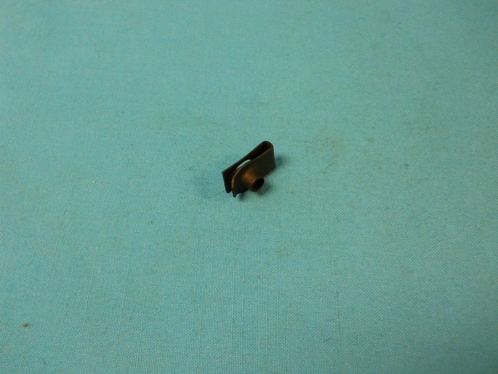 Extruded "U" nut.  1/4-20 screw panel range .025" - .150".  Center of hole to edge 17/32".