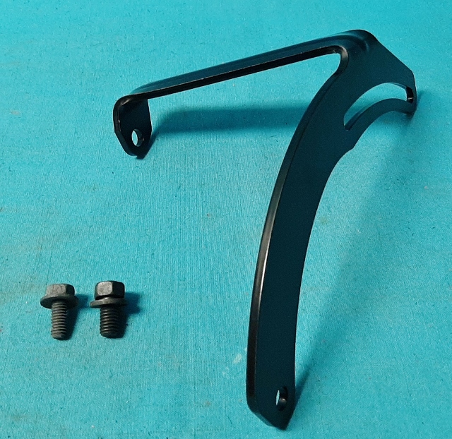 Alternator adj. strap - Small Block engines with A/C   Strap is formed from the correct gauge steel with the correct emboss features to strengthen the mounting arm.  Includes
the correct 5/16-18 mounting screw for the alternator and  also includes the correct 3/8-16 mounting bolt for the cylinder head. Powder Coated low gloss black for original appearance.
Original part #2951 868