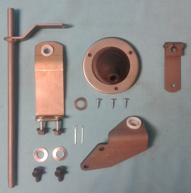 Gearshift Control Assembly.  Includes gearshift control torque shaft, upper support bracket & Bushing, lower support bracket & bushing, gearshift control lever, the torque shaft boot with open cell gasket & formed mounting flange and hardware