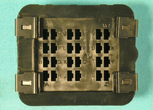 Bulkhead Connector to firewall.  Engine harness plugs into this square bulkhead connector.