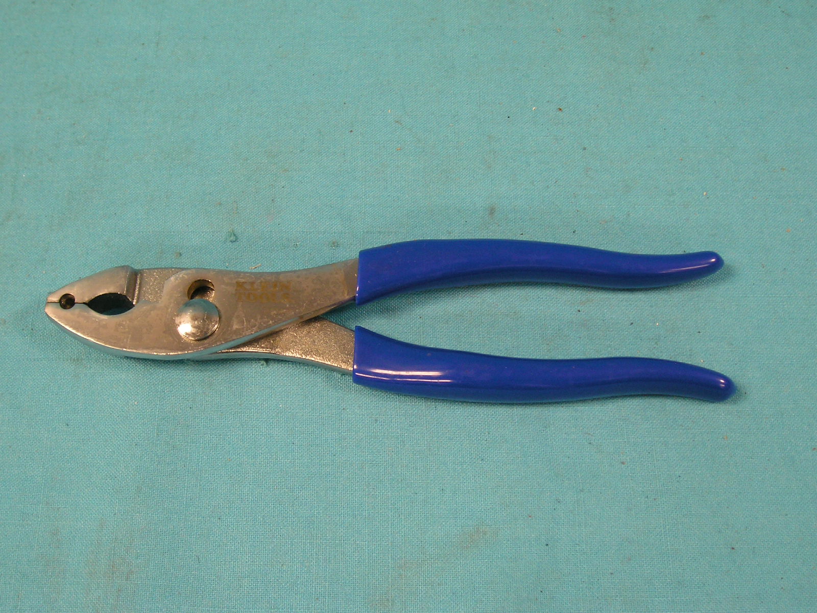 Spring-Hose Clamp Pliers.  Jaws have grooves that grip the ends of the spring clamps to prevent slipping and twisting.  Made of forged steel and are 8-1/16" long.