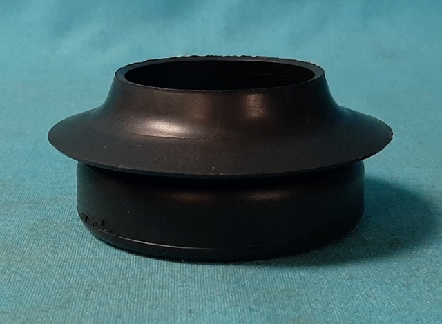 Fuel filler Tank grommet.  Replaces original part #4002 010 - reproduction.  1-15/16" inside diameter.  3-1/8" outside diameter.