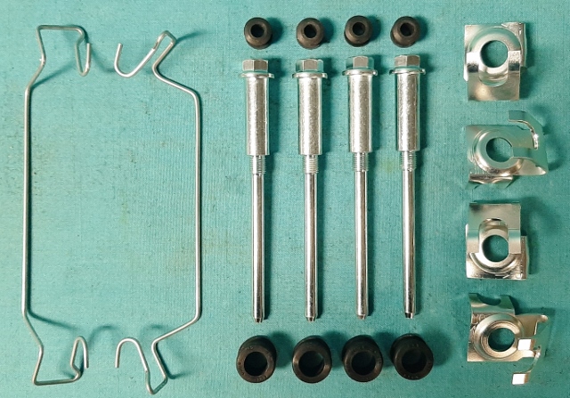 Caliper Hardware Kit - Kelsey Hayes Calipers – service for both.  Four disc brake housing locating pins, inner and outer bushings for both calipers, four pin positioners, and both outer pad retaining springs.
