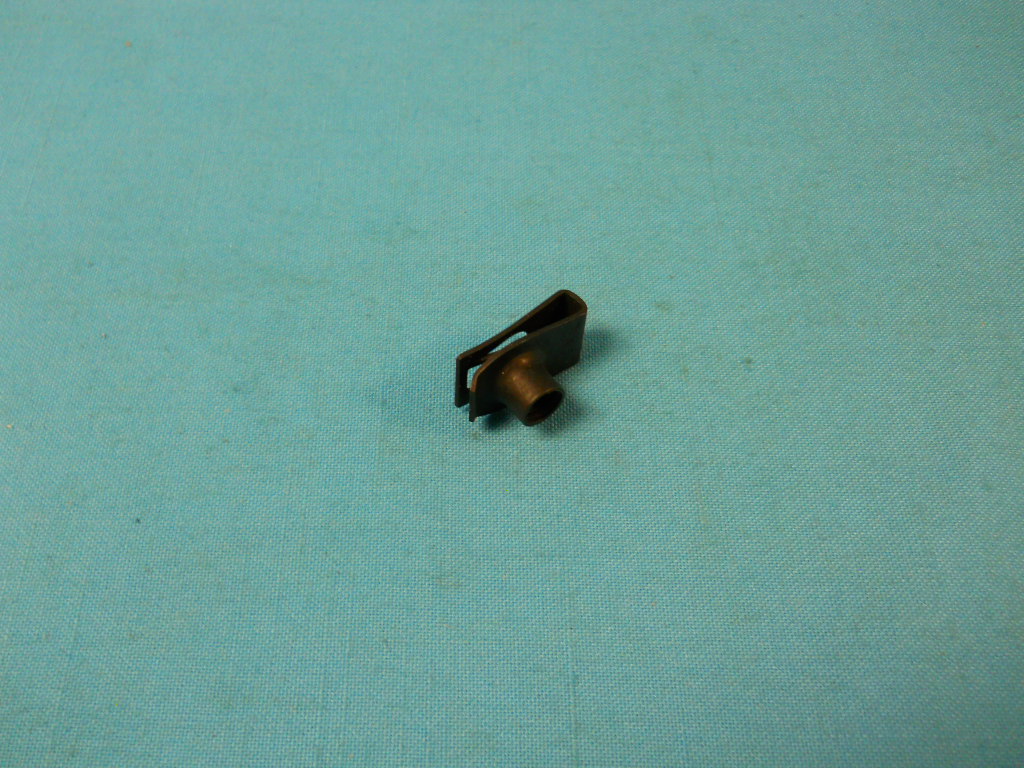 Extruded "U" nut.  5/16 - 18 screw panel range .025" - .060" Center of hole to edge 9/16"