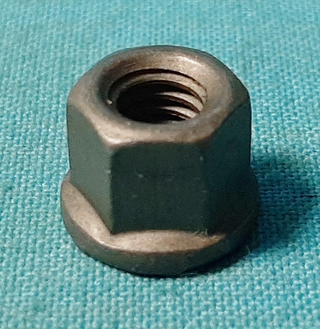 Carburetor Linkage Stud Nut - used from mid 1970's and later applications. Each nut is unique for the years of application, with part #336-40692 the stamped flange washer end & Special locking patch.  Both parts finished in zinc phosphate & oil.