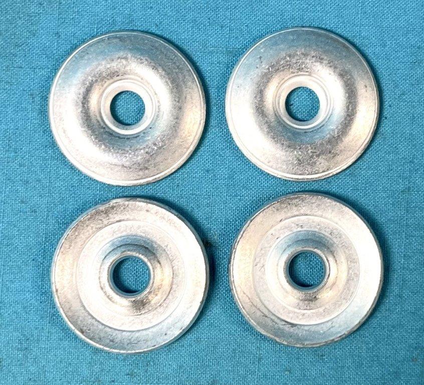 Upper Shock Bushing Retainer Set.  Excellent reproductions of the upper shock absorber bushing retaining washers.  Cadmium plated.  Set of (4)