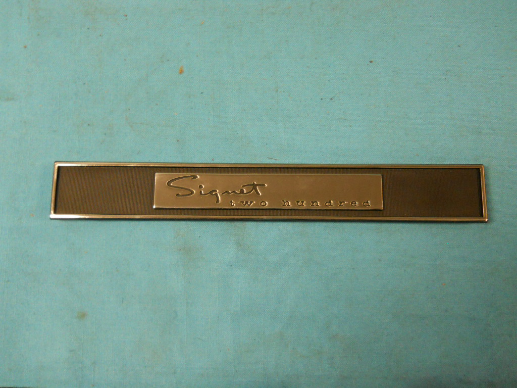 Inner Door panel emblem - "Signet 200" - rectangular piece on inner door panel just below vent wing window.  NEW two part alloy that won't pit - these are better quality than originals