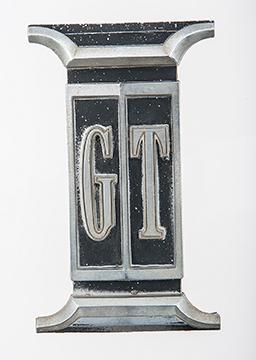 "GT" grill emblem.  Original part # 2582 099