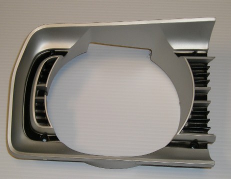 Passenger side headlight bezel