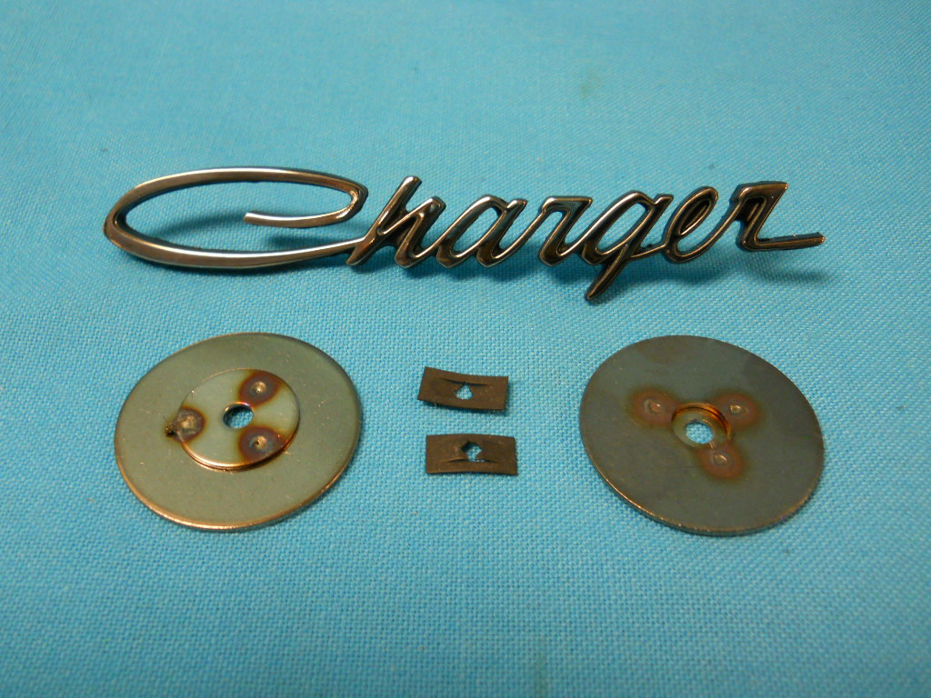 Door Pad Emblem - upper - Black edge (each) - includes both round backing plates for installation as well.