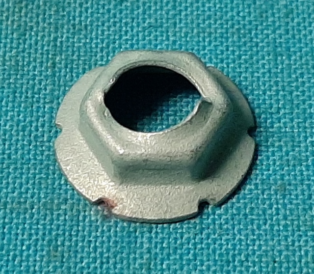 Stamped threaded nut - 5/16 x 1/2 AF wthi .75 OD.  Found used on 1972-76 Side Marker Lens posts (sold each)