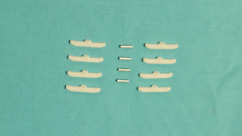 Hardware kit - 8 plastic nylon clips / 4 metal guide pins.  Used for part # 389-38285.  This hardware kit is also available here separately.