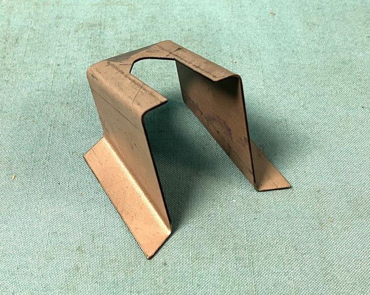 Spare tire Retainer bracket.  You tack weld this to the top of the trunk extensions when you purchase new trunk extensions.