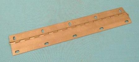 Console Door "Hinge".  Allows operation of the console door - needed if yours are rusted or broken or outright missing.