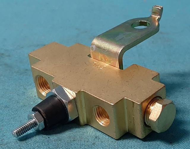 Distribution Block.  Brass 5 port valve disc. or Drum Brake.  Some Mopar's had the texas shaped valve and the distribution combined into one valve.  If so - see valve part # 327-45108 for the one piece valve.