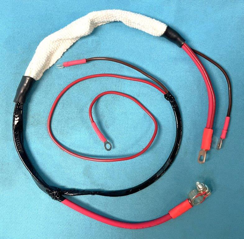 Positive Battery Cable - close reproduction to the orignals, this cable has rounded head versus the original square head.  Cable is heavy gauge #0 wire for the primary and #8 gauge for the secondary leads, all terminals ends would be copper and covered with proper positive heat loom and industrial shrinkwrap - RED in color.
