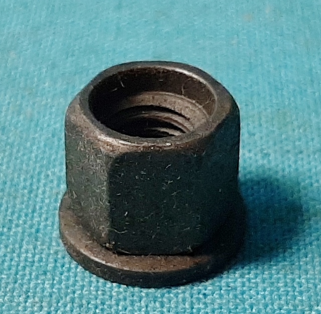Carburetor Linkage Stud Nut. Nut is unique for the years of application, with part #392-40691 having the conical spin washer & recessed thread end. Part finished in zinc phosphate & oil.  Used with carburetor linkage studs found in prior section.
