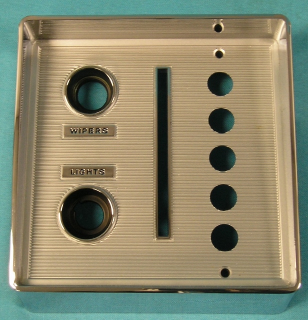Automatic Shifter Bezel - to the left side of the dash bezel (holes for pushbuttons and wiper and light).