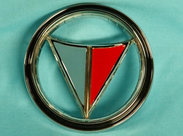 Valiant Signet-200 trunk emblem - part # 2422 631.  Small imperfection on the side of this piece from the tool.  This imperfection is about size of a pin head and is at the 5-o'clock position / on the side / of this piece.