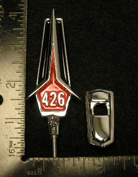 Hood ornament "426". Includes chrome base & mounting stud. Emblem has red and black painted reliefs.  Discount Exempt