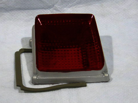 Drivers side Taillight lens - has silver paint on the sides of the lens - discount exempt