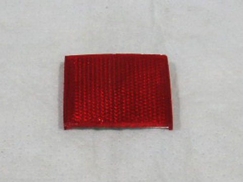Taillight Outer red square reflector. 2 needed per car. These are glued to the lens.  Has the following number on the top outside edge of the lens #3506499
