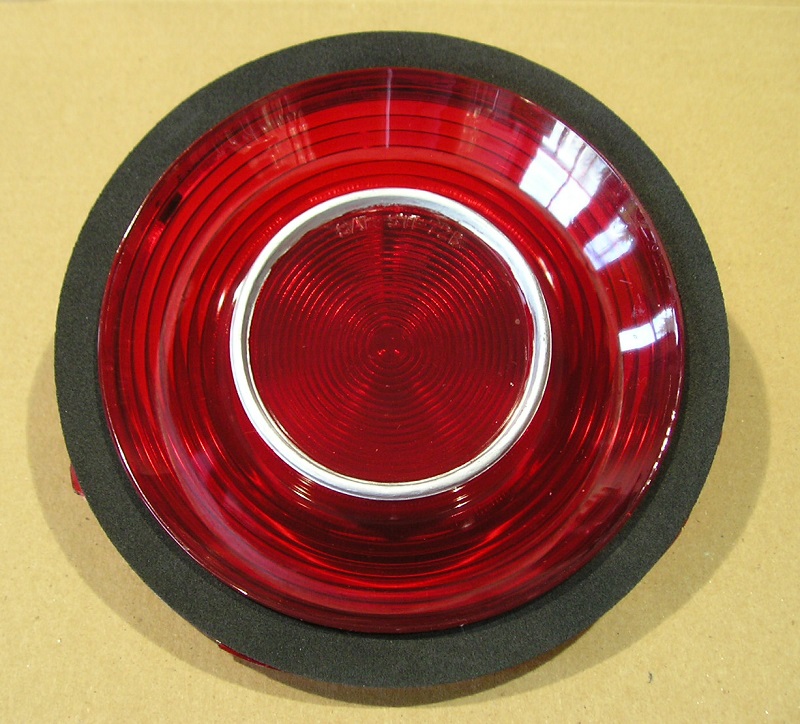 Outer Tailight lens(fits either left OR right) and gasket - Black plastic bezel IS included but not in photo image.  Discount exempt