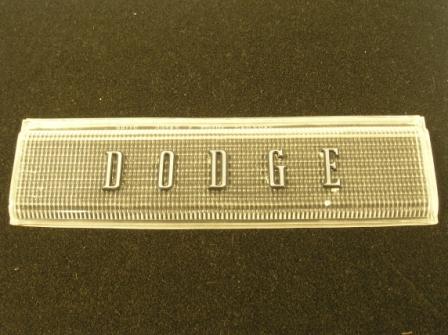 Backup Light Lens w/"DODGE" Letters on Lens. Some excessive gluing on back of lens.