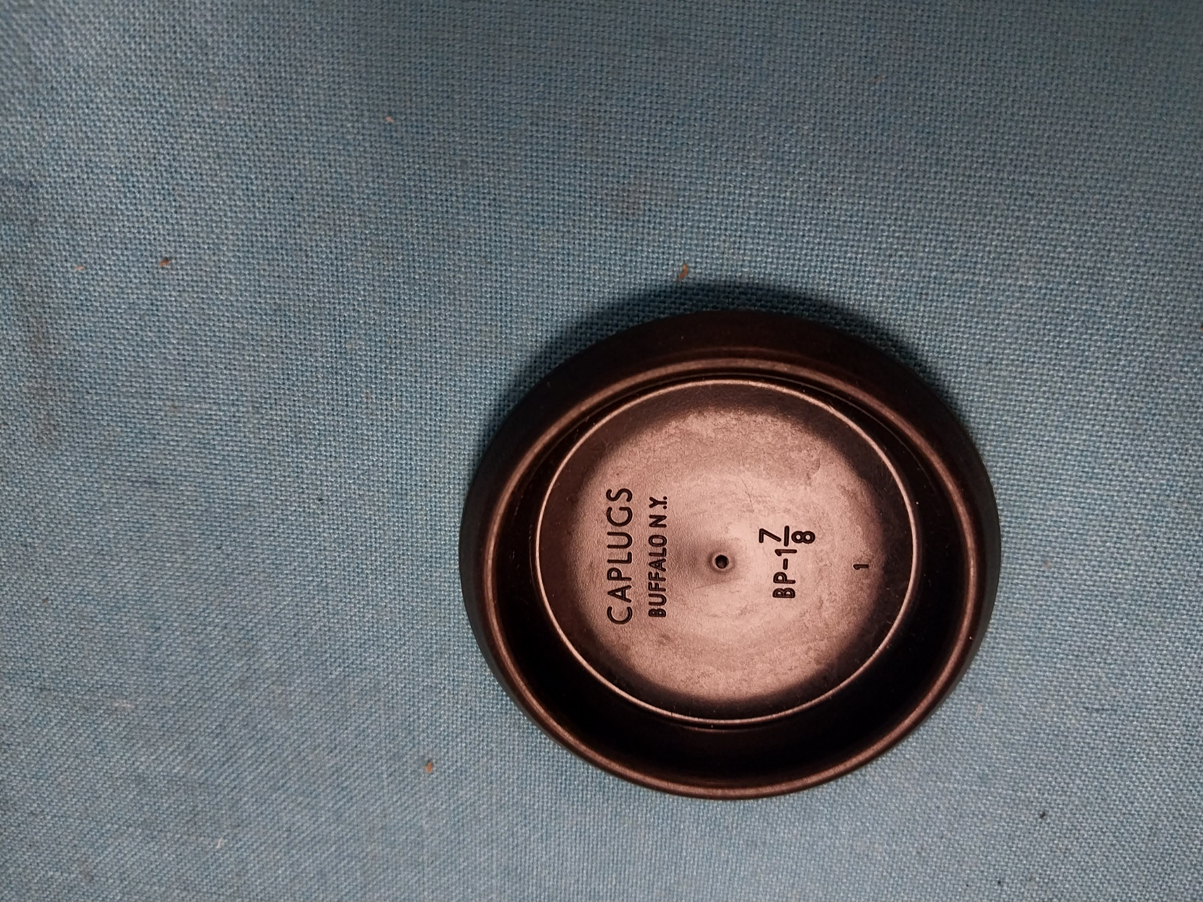 Recess sheet metal plug in black plastic 1-7/8"