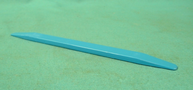 Plastic insert tool for installation of glass into rubber channels and gaskets.