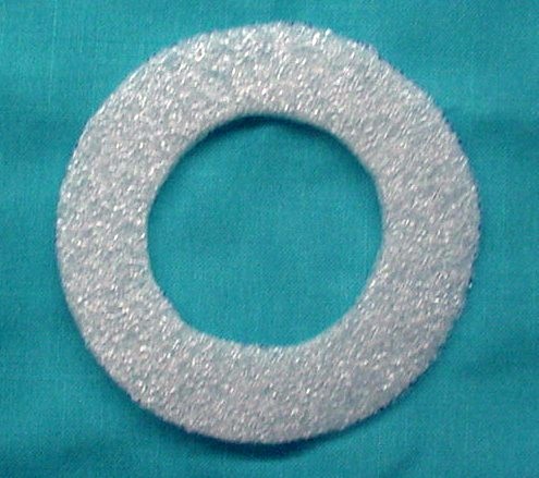 Fuel Filler Neck Flange Seal - Seals the filler neck flange to the quarter panel. Mounts inside trunk between end of filler tube and quarter panel.