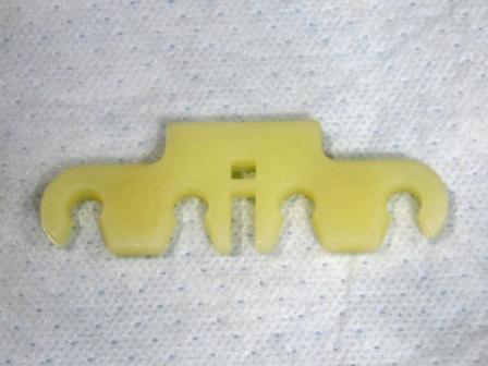 Small-block Spark Plug Wire Retainer. White, like original - holds 4 wires. This retainer snaps onto the welded tabs located on the valve covers. Reproduction. Use 2 per car.