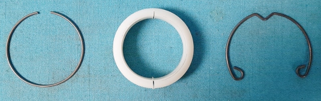 White lower shift tube bearing with spring.