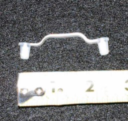 Clear plastic strap-plugs into 2 holes.  Holds wires and hoses on left inner fender.  63-66 A-body use 3, 67-70 A-body and 1966-70 B-body use 4.