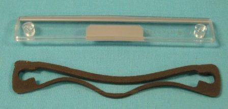 License Plate lens - This is 7" long by 1" wide. Argent silver pain on one edge.  Discount exempt