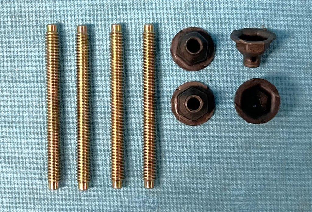 Rear wing spoiler mounting studs. Contains four zinc dichromate plated studs and four hollow nuts to secure the studs. Reproduction (set of 4)