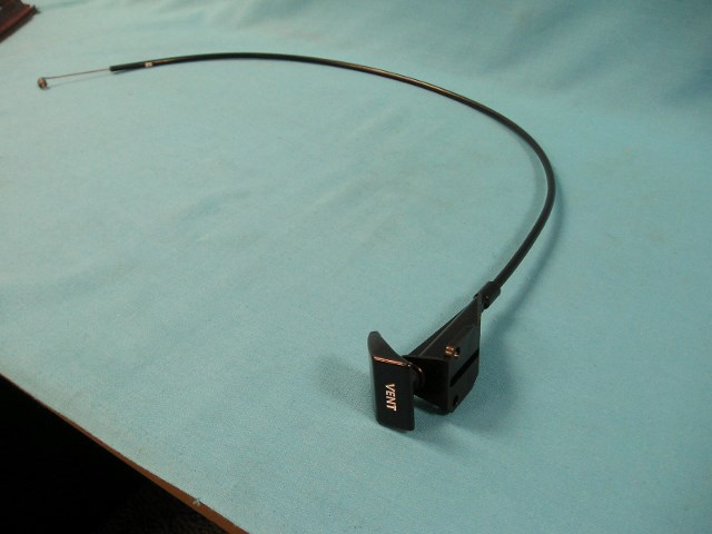 Driver Side Vent Cable. Square handle with incised, White “VENT” lettering