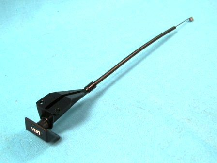 Drivers side vent cable (Also used on cars with A/C). Square handle with incised, White “VENT” lettering