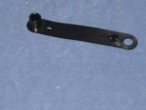 Battery Cable Strap - This is a commonly missing or broken positive battery cable strap. The Black plastic strap slides on top of the stud on the left front shock absorber. The strap then wraps around and secures the positive battery cable.