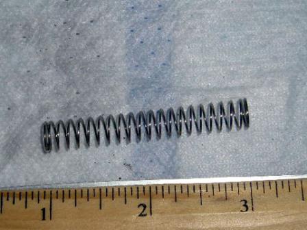 Push button transmission spring