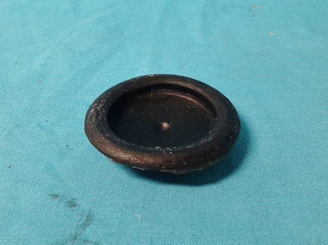 Rubber body plug for 2-1/4" hole ID to 2-1/2" OD on portion that goes through the Sheetmetal - it has a taper to it so depending on how you measure - at the back of the taper it is 2-1/4" at the top it is 2-1/2" - used many times for the spare tire well trunk floor plugs...
