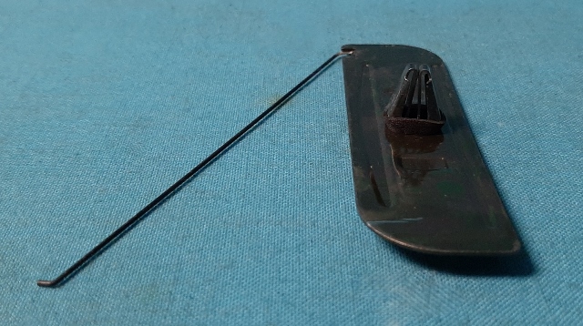 Molding Fastener.  size of clip itself is 3-15/16" long by 1-1/8" wide.  The center clip plug that goes into the hole on the car to fasten is 1/2" X 1/4"