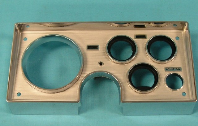 Instrument Plastic Bezel - chromed and fully detailed.  New Reproduction.  No lens with this reproduction.  The green turn indicator lens and red oil indicator lens is included.  The Red high beam lens is NOT included and you would have to re-use your old one.