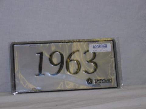 License Plate Silver plate, shows the year (1963) of the car in black script.